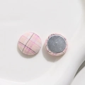 Close-up of pink and white checkered fabric covered round buttons with metal back bases - Small Round Style / Pink