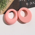 Close-up of pink oval resin earrings with smooth geometric hollow design for DIY jewelry - Pink