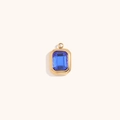 Close-up of 18K gold plated rectangular pendant with emerald-cut blue gemstone - Gold-Royal Blue Zirconia