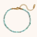 Detailed macro of 18K gold plated anklet with turquoise beads and K18 hallmark tag - Turquoise