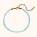 Detail of light blue faceted natural stone bracelet with 18K gold plated clasp and tag - Amazonite