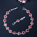 S925 silver bracelet featuring red cubic zirconia heart settings and adjustable chain - Red