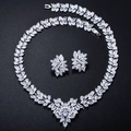 Macro detail of silver necklace and earrings set with marquise and pear cut zircons - Necklace And Earring Post Set
