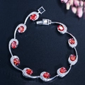 Elegante zilverkleurige armband met robijnrode zirkonia en wit pavé gezette stenen - Rood