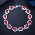 Bracelet fleuri plaqué or blanc 18K avec rubis ovales rouges et zircons scintillants - Rouge