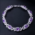 Bracelet floral élégant avec zircons violets ovales et cristaux blancs étincelants - Violet