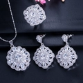 Detailed view of silver flower jewelry set with sparkling crystals on black texture - White Style (Size 6)