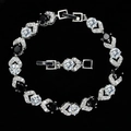 Detail of silver bracelet with clear AAA zircons, black stones, and fold-over clasp - Black and White
