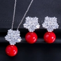 Macro detail of snowflake bridal jewelry set with red pearls and zircon accents - Red Pearl