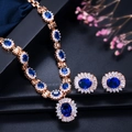 Conjunto de joyas de novia doradas con piedras ovaladas azules y cristales brillantes - Azul