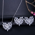 Close-up of sparkling heart-shaped zircon necklace and earrings jewelry set on black fabric - Necklace Earrings (KI0033) / White Zirconia Silver