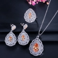 Detailed set of pear-cut orange zircon jewelry with a ring, necklace, and earrings - Champagne