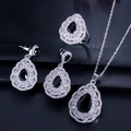 Macro shot of silver jewelry set with pear-cut black stones and white zircon accents - Black