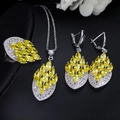 Close-up of bridal jewelry set with yellow marquise stones on black background - Yellow