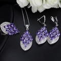 Detailed view of bridal jewelry set with purple marquise zircon and silver leaf patterns - Purple