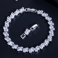 Classic silver tennis bracelet featuring baguette-cut AAA cubic zirconia on black background - White