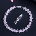 Macro detail of luxury pink and white cubic zirconia bracelet with silver metal setting - Pink