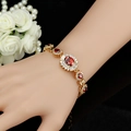 Vintage vergoldetes Kupferarmband mit roten ovalen Zirkonen und weißen Diamantakzenten - Rot