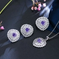 Macro shot of silver jewelry set featuring purple heart stones and pavé zircon accents - US 7 / Purple