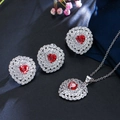 Macro shot of silver heart jewelry set featuring red stones on blue velvet backdrop - US 7 / Red