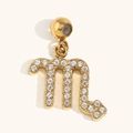 18K gold plated Scorpio zodiac pendant with sparkling cubic zirconia on beige background - Scorpio
