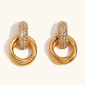 18K gold plated stainless steel hoop earrings with white zircon crystals on a beige background - White Zircon Hoop Studs - Gold