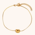Detailed macro of 18K gold-plated bubble letter S charm with adjustable link chain - Letter C / Gold