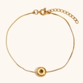 Macro view of 18K gold plated chain bracelet with doughnut ring charm and lobster clasp - Letter O / Gold
