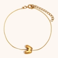Detail of 18K gold plated chain bracelet with a puffy 3D letter B charm and lobster clasp - Letter W / Gold
