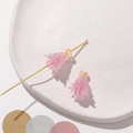 Detailed macro view of pink resin Christmas tree bead with textured relief on ceramic plate - 1 Piece / Deep Pink