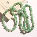 Macro shot of irregular natural green stone chips for DIY jewelry making and beadwork - Dongling Green Chips