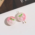 Close-up of pink resin cherry beads with a golden pin showing the DIY assembly detail - 1 Piece / Pink & White