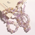 Macro shot of irregular natural amethyst and citrine stone beads on a book surface - Natural Amethyst Chips