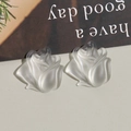 Detailed close-up of matte resin tulip and rose charms for DIY jewelry and phone cases - Rose Bud Style