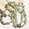 Macro detail of irregular natural green prehnite stone beads for DIY jewelry making - Prehnite Chips