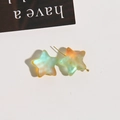 Close-up of matte gradient star earrings with translucent finish and gold-tone studs - 1 Piece / Orange Green