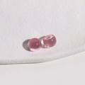 Close-up of 10mm pink translucent resin round beads for DIY jewelry and hair accessories - Pink