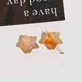 Macro detail of star-shaped frosted resin bead with orange and white marble texture - 1 Piece/Pack / Dark Orange