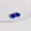 Macro shot of 10mm deep blue translucent resin cabochons with smooth rounded surface - Dark Blue