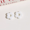 Close-up of white six-petal flower beads for DIY jewelry with center hole for stringing - White