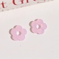 Close-up of pink translucent resin flower beads with center holes for DIY jewelry - Pink