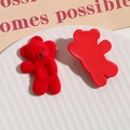Detail shot of red flocked bear charms for DIY jewelry and hair accessories craft - Red Bear
