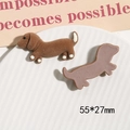 Brown flocked dachshund resin patch for DIY accessories shown on a white ceramic plate - Light Coffee Flocked Dog