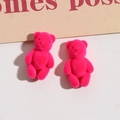 Close-up of hot pink flocked mini bear pendants for DIY jewelry and accessories - Rose Red