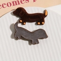 Detailed view showing front and back of flocked dachshund DIY patches on a white dish - Dark Coffee Dachshund