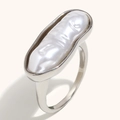 Modern 18K gold plated stainless steel ring featuring a long baroque pearl on beige background - US 6 / Long Bar Pearl Ring / Steel