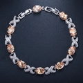 Elegant XO silver bracelet featuring champagne stones and sparkling zircon accents - Champagne
