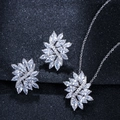 Macro view of crystal marquise zircon feather pendant and earring jewelry set details - Necklace + Earrings
