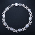 Detail of silver XO bracelet with oval AAA zircons and micro-paved cross links - White
