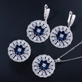Macro view of flower-shaped jewelry set featuring deep blue pear zircon and silver plating - Sapphire Blue